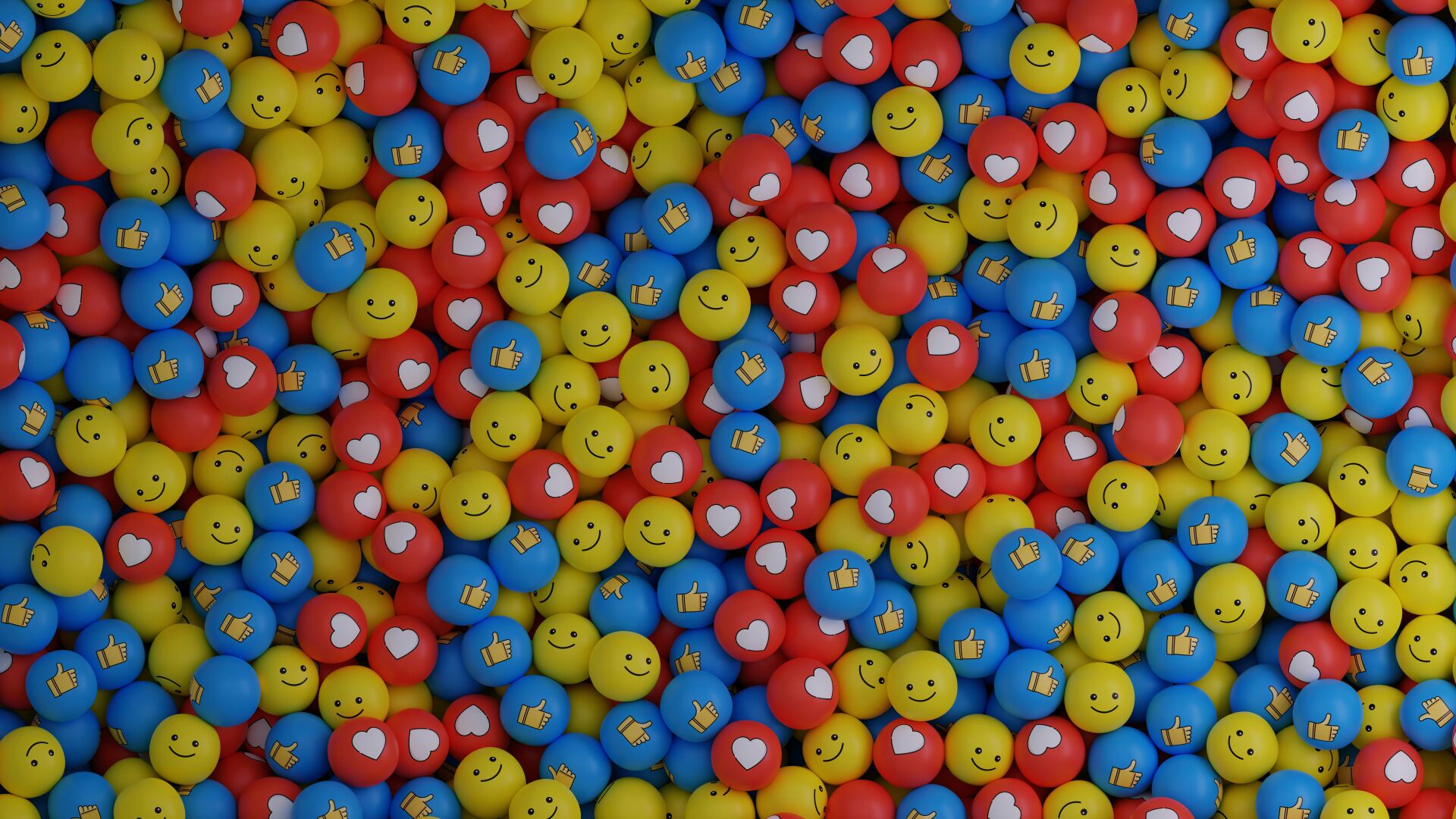Balles jaune, vert, rouge avec smiley, pouce levé et cœur